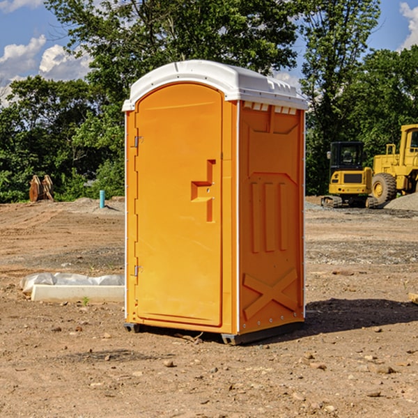 what is the cost difference between standard and deluxe portable toilet rentals in Flint Hill